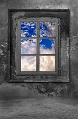 Old window in a cold concrete room