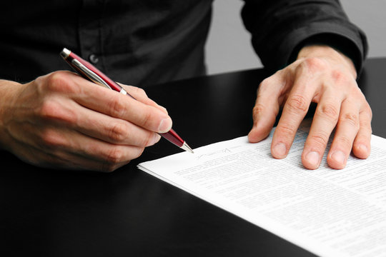 businessman signing a contract