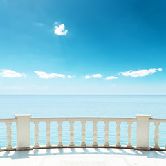 balcony near sea under deep blue sky