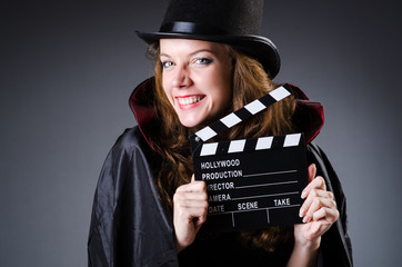 Woman with movie clapper board