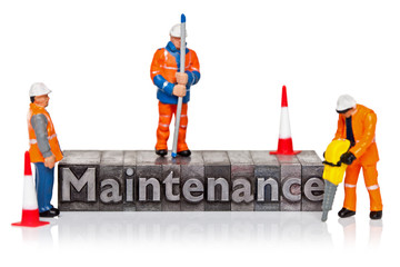 Fototapeta premium Maintenance word in letterpress with miniature workmen