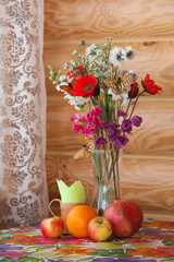 Fototapeta na wymiar Summer still life and with flowers and fruits