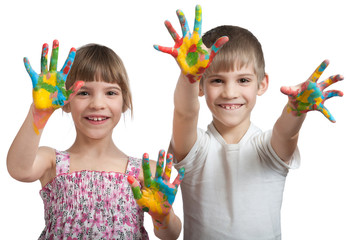 kids show their hands soiled in a paint