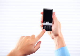 Hands of woman with a smartphone.