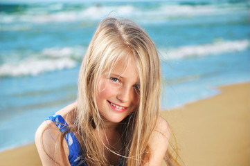 Portrait of little girl on a sandy beach
