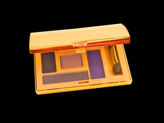 luxe purple and beige make-up eyeshadows in gold packing isolate