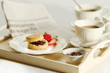 Scone with strawberry jam and clotted cream , afternoon tea brea