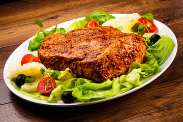 Raw, marinated pork and vegetables