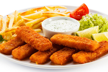 Fried fish fingers, French fries and vegetables