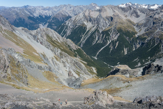walkers descending to glacial valley in Southern Alps