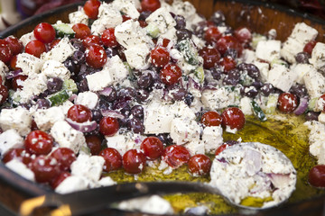 Close up of greek salad for sale on the street market