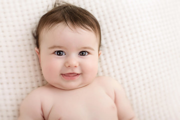 portrait of a baby who smiles