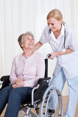 Caring Doctor Helping Handicapped Patient