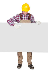 Construction worker presenting empty banner