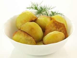 Roasted potatoes, closeup, isolated