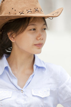 side of asian women with cowboy leather hat