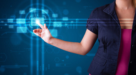 Woman pressing high tech type of modern buttons