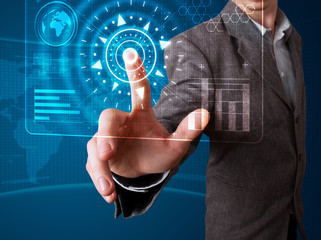 Businessman pressing high tech type of modern buttons