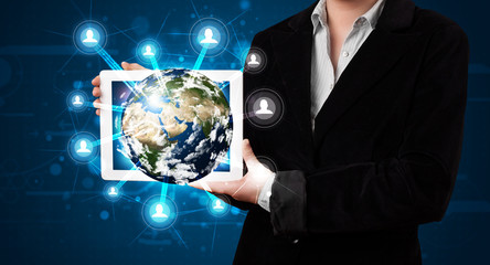 Woman presenting 3d earth globe in modern tablet