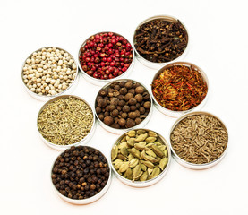 Nine types of spices in small bowls