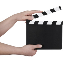 Hands holding a film clapperboard with clipping path - obrazy, fototapety, plakaty