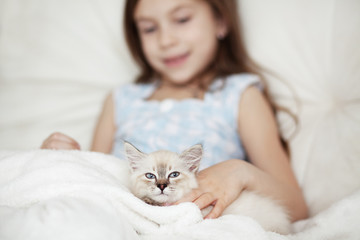 Child and kitten