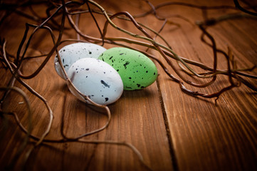 Easter eggs on wooden plank