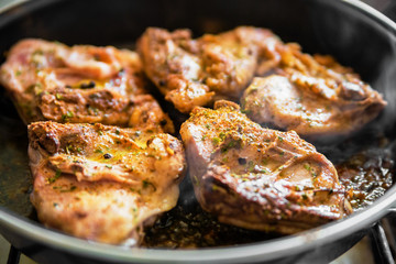 Chicken on frying pan