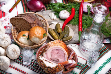 table top full of vegetables, pork belly, bread and other foods