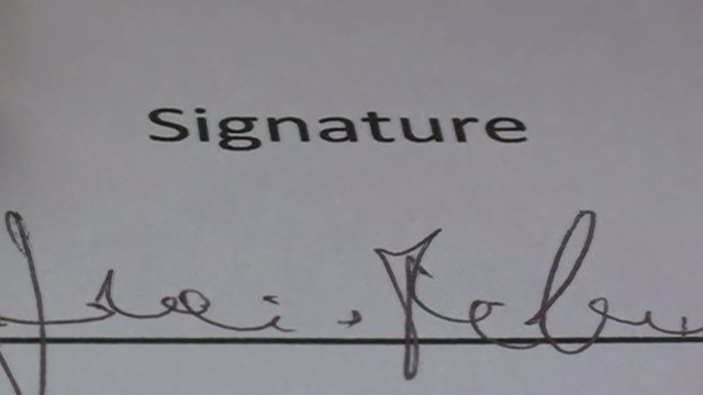 signing of the contract with an elegant ballpoint pen