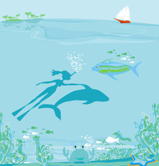 The girl-diver floats together with a dolphin