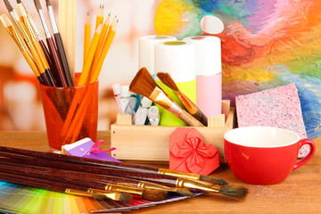 Artistic equipment: paint, brushes and art palette