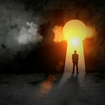 Silhouette of businessman in keyhole