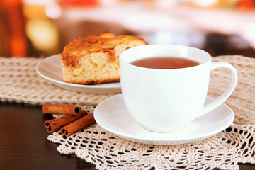 cup of tea with scarf on table in room