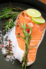 Fresh salmon steak on pan, close up