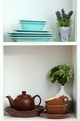 Beautiful white shelves with tableware and decor.