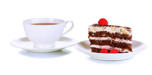 A cup of tea and delicious cake isolated on white