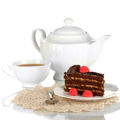 Teapot, cup of tea and delicious cake isolated on white