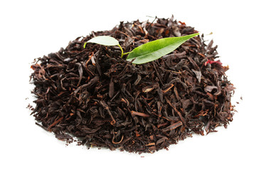 Dry black tea with green leaves, isolated on white