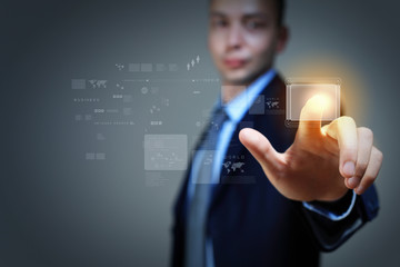 Business man touching display