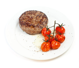 Beef steak and baked tomatoes