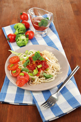 Tasty spaghetti with sauce and vegetables