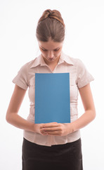 A woman holding a sheet of paper