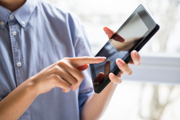 woman using digital tablet