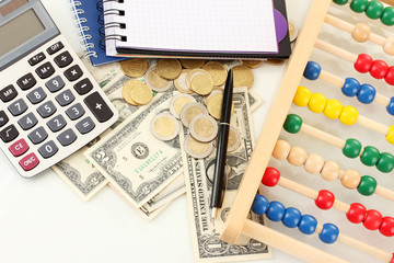 Bright wooden abacus and calculator. Conceptual photo of old