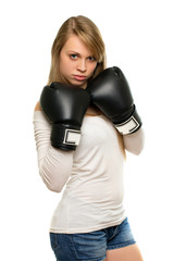 Young woman posing with boxing gloves