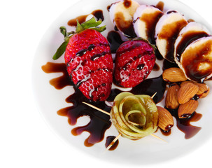 Fruit in chocolate isolated on white