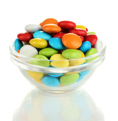 Colorful candies in glass bowl isolated on white