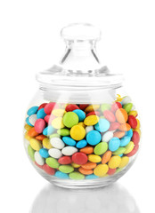 Colorful candies in glass jar isolated on white