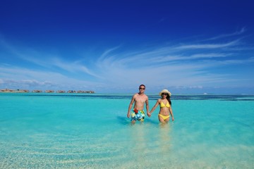 happy young  couple enjoying summer on beach